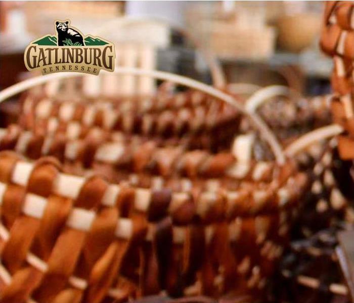 closeup of woven baskets with Gatlinburg logo in background