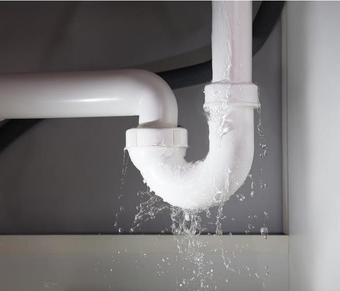 water leaking from drainpipe under sink