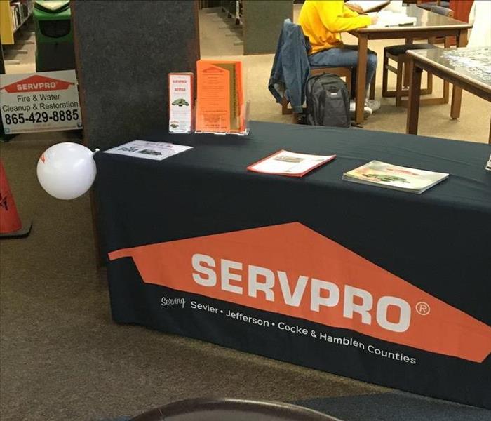 servpro sign on folding table display