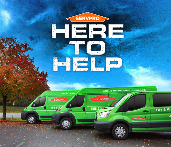 here to help with three servpro vehicles